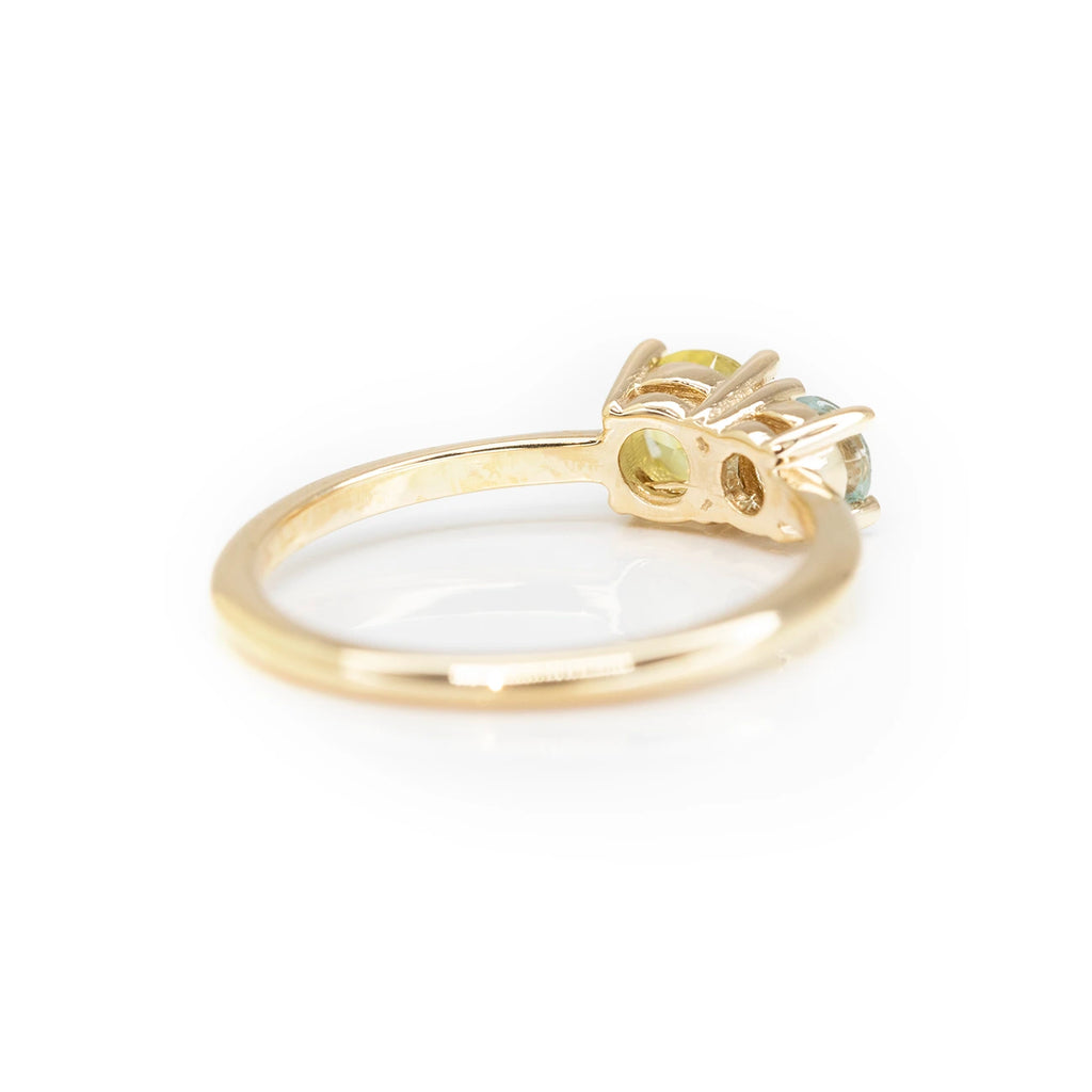 back view of yellow gold custom made lico jewelry engagement ring in montreal at boutique ruby mardi on white background