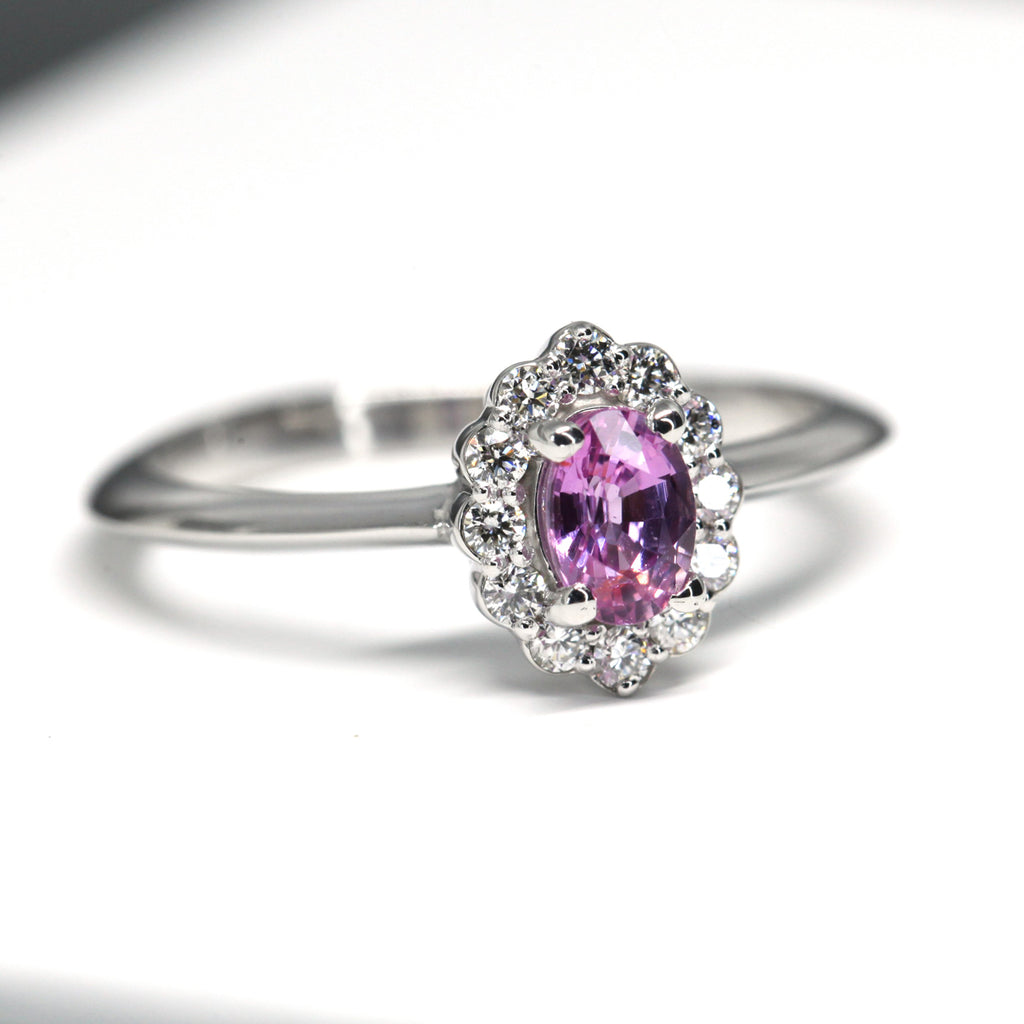 oval shape pink sapphire diamond halo custom made bridal ring montreal ruby mardi jeweller on a white background