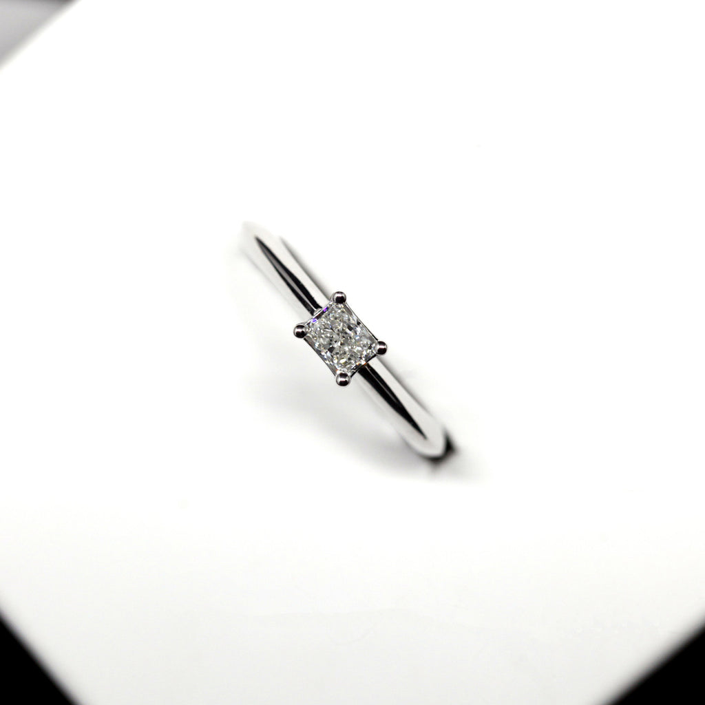 diamond radiant shape minimalist white gold custom made engagement ring custom handmade by artisan jewellery designer best jeweler in montreal ruby mardi on a white background