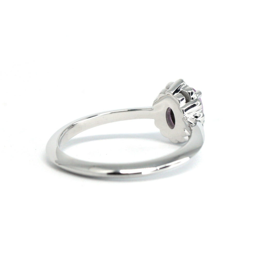 back view of white gold custom made enagement ring in montreal little italy jeweller ruby mardi on a white background