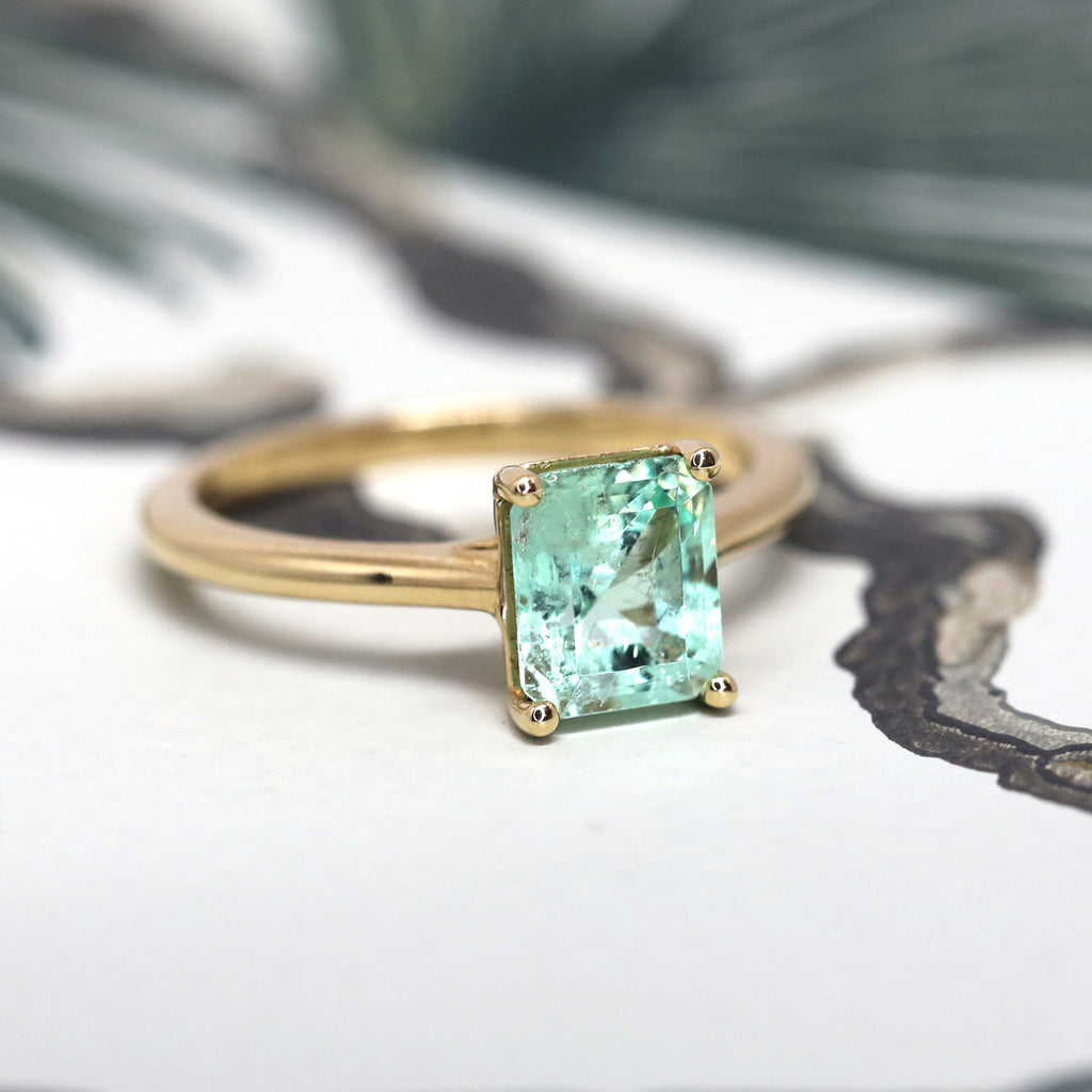 Solitaire 14k yellow gold engagement ring featuring a big ethical emerald mint from MUZO mine in Brazil. A design from Lico Jewelry available in Montreal at high end jewelry store Ruby Mardi.