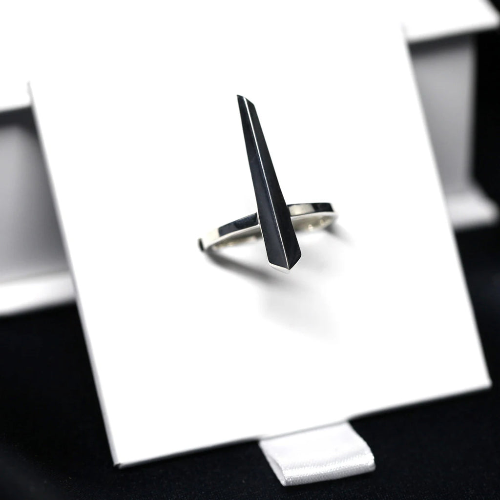 Sturdy ring in sterling silver photographed under different lightnings. A Minimalist, modern and elegant piece of jewelry. Find this gender-neutral ring that fits both classic and edgy wardrobes at Ruby Mardi, online or at our concept-store in Montreal’s Little Italy.