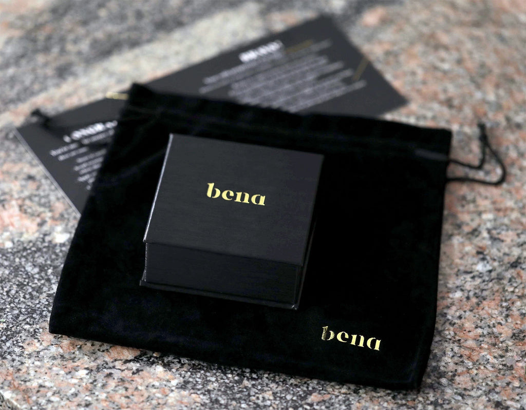 Black jewellery box from Bena Jewelry, Montreal. Packaging seen on a natural marble.