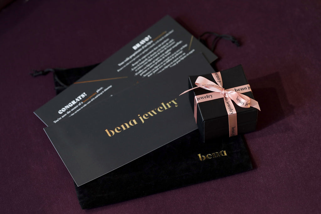 Bena Jewelry packaging, care guide and velvet pouch.
