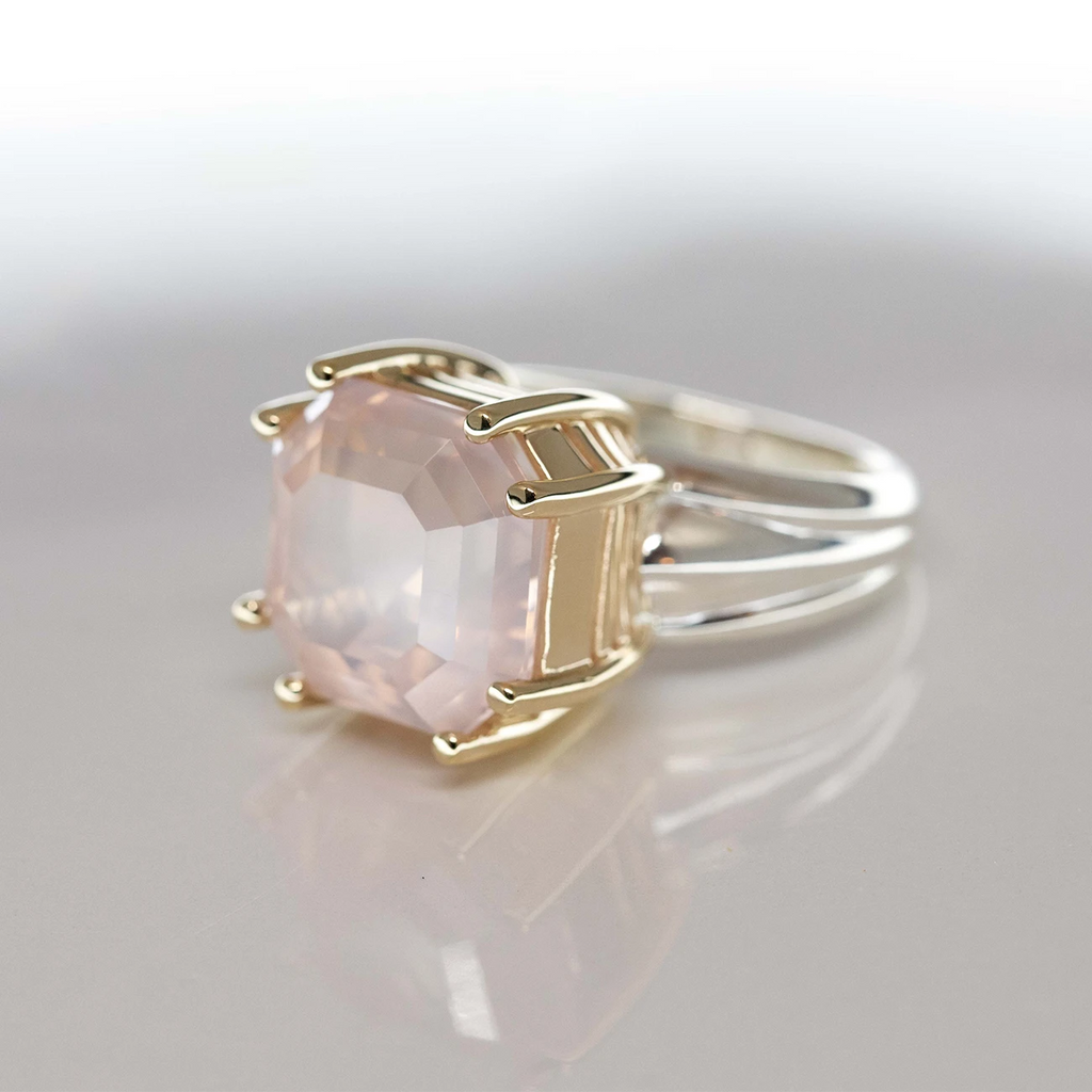 side view of octagon yellow gold statement artisan designer custom made ring with a light pink color natural rose quartz gemstone made in montreal by ruby mardi on a grey background