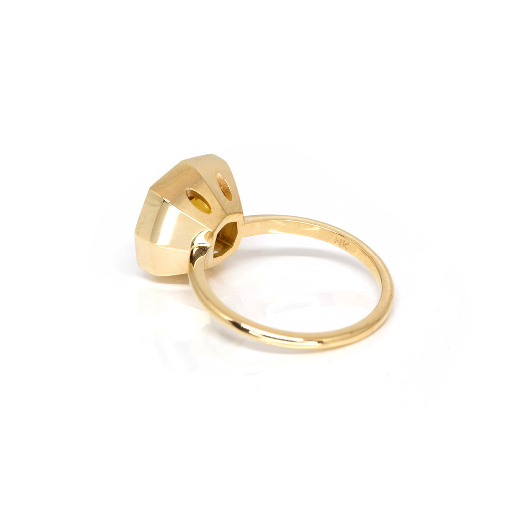 back view of yellow gold bezel setting statement artisan ring made by jewellery designer montreal boutique ruby mardi jeweler in little italy rosemont on a white background