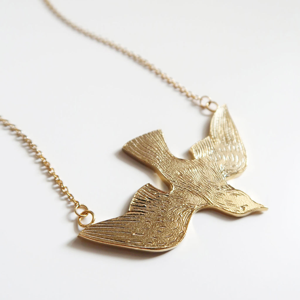 Beautiful and quite big gold vermeil flying bird pendant, handmade in Toronto by jewelry brand Invidiosa Jewelry, and available in Montreal, only at Ruby Mardi, a concept-store that has love as an obsession.