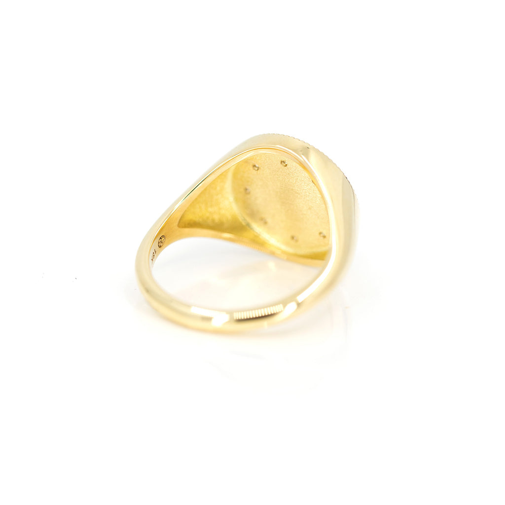 back view of yellow gold signet ring custom made in montreal by emily gill finest jewelry designer in canada at ruby mardi jeweler montreal on white background
