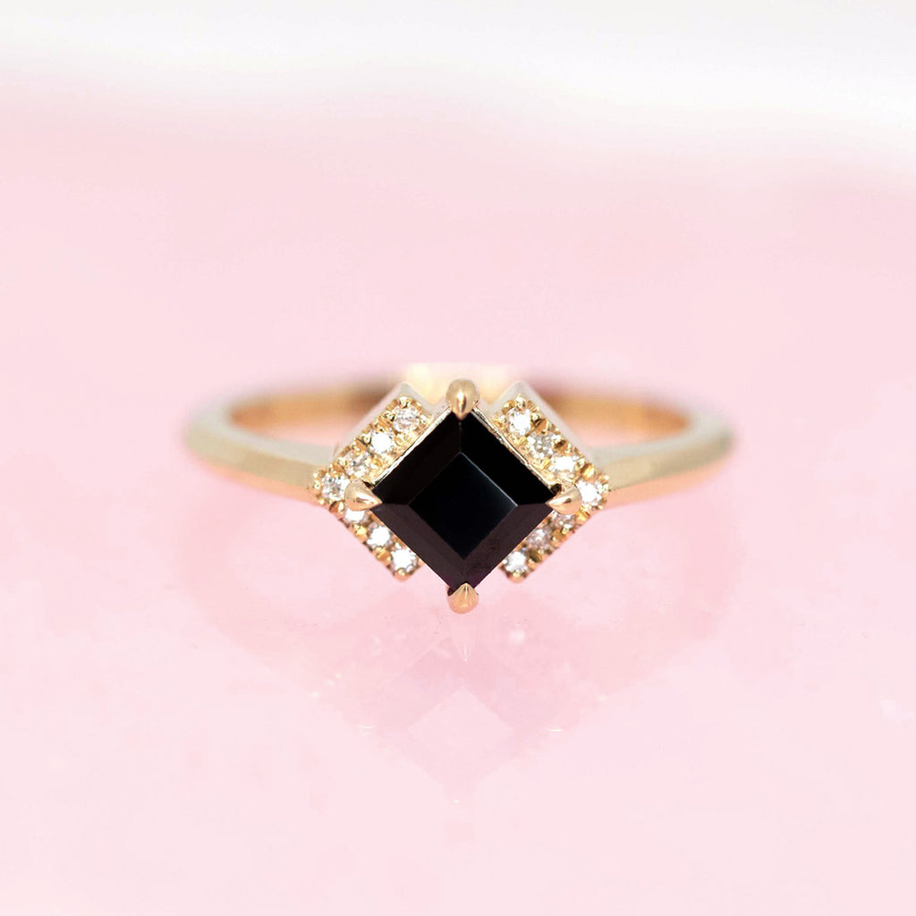 Front view of the edgy engagement ring by jewelry designer Liane Vaz made with mossonite and the black natural gemstone spinel. This edgy bridal ring is available at Canada's only independent designer jewelry gallery Ruby Mardi.