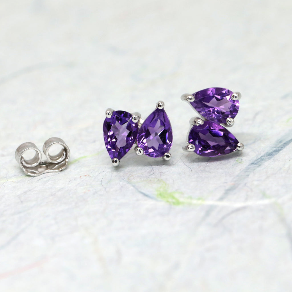 Ruby Mardi offers lovely simple gemstone stud earrings that shine and add a pop of colour to your ear.   Here, beautiful double pear cut amethyst set in silver. We carefully select the gemstones so they are all of the highest quality. We prioritize traceable and natural gems. Ruby Mardi also offers custom jewelry services in Montreal.