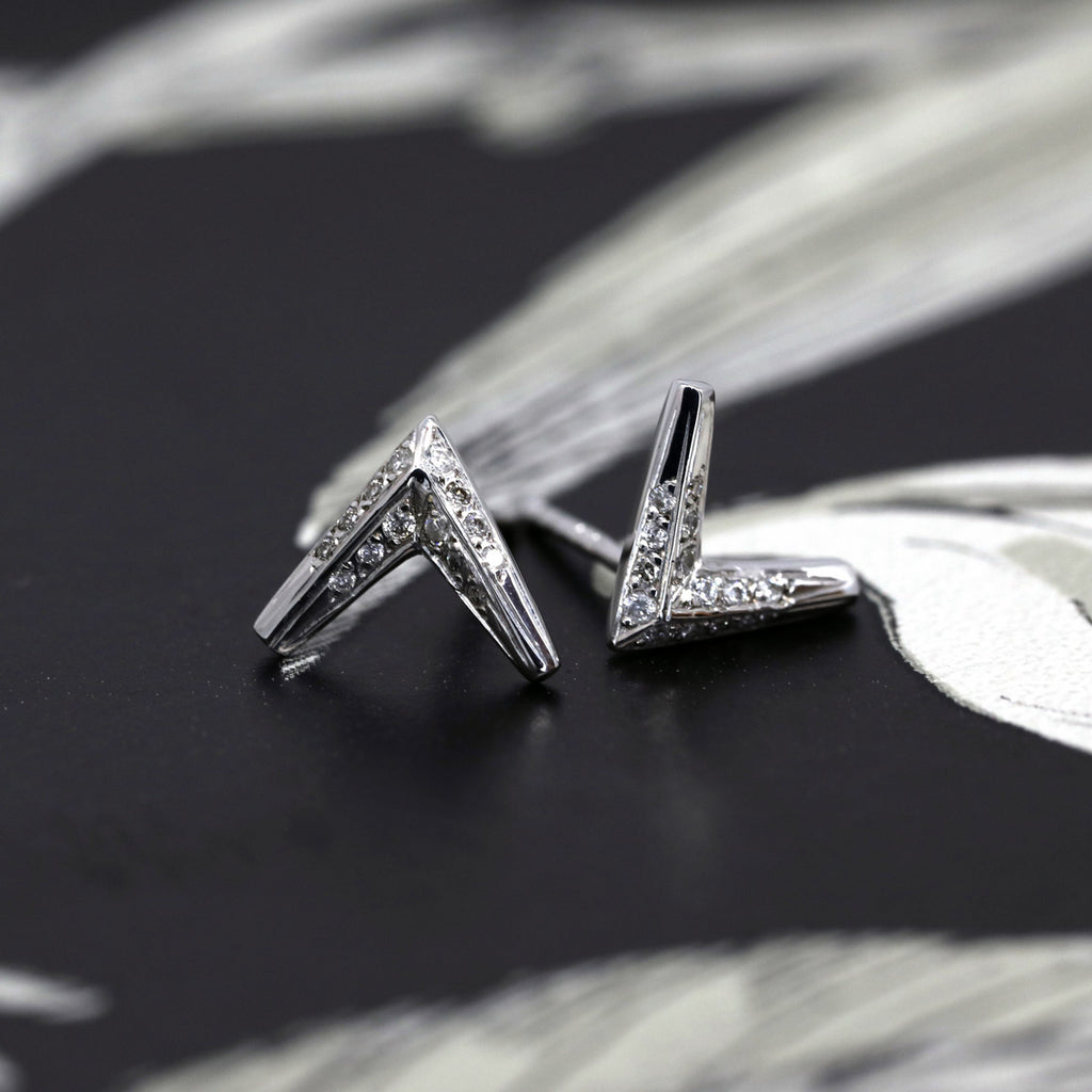 High end jewelry by Bena Jewelry. Simple yet studied arrow earrings in diamond and 14k white gold. Find them online or at our fine jewelry store in Montreal's Little Italy. Ruby Mardi also offers custom jewelry services in Montreal, engagement rings and heirloom jewelry.