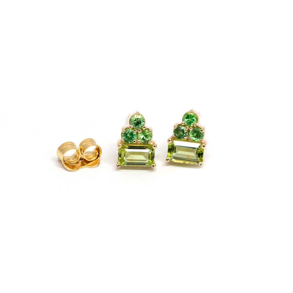 Ruby Mardi offers a lovely collection of funky fine gemstone stud earrings that shine and add a pop of colour to your ear.   Here, beautiful baguette cut peridot with round tsavorite garnet, et in 14k yellow gold. We carefully select the gemstones so they are all of the highest quality. We prioritize traceable and natural gems. Ruby Mardi also offers custom jewelry services in Montreal.