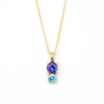 tanzanite and natural blue zircon gemstone pendant made by lico jewelry designer in montreal for boutique ruby mardi best jewellry store in canadian designers on white background