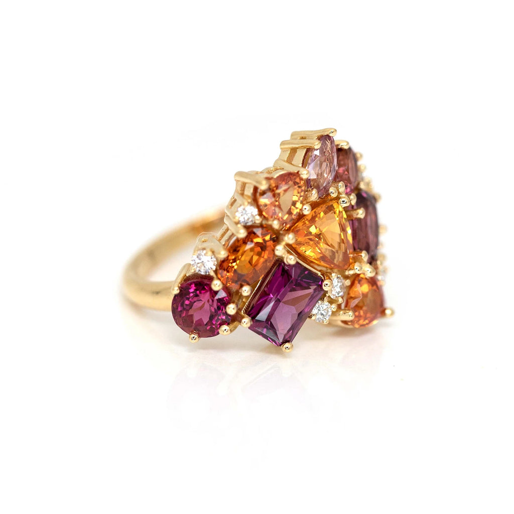 side view of custom made bridal ring with red tourmaline orange garnet and diamond yellow gold ring montreal made by boutique ruby mardi on a white background