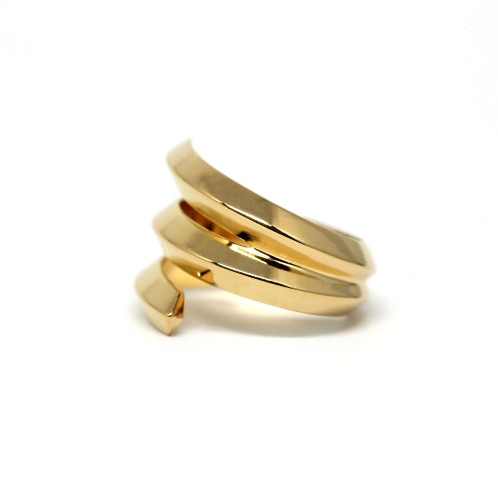 Embrace ring in gold vermeil on a white background photographed in close-up. Ready-to-wear fashion jewelry available online or at our concept store in Montreal's Little Italy, along with the work of other talented jewelry designers.