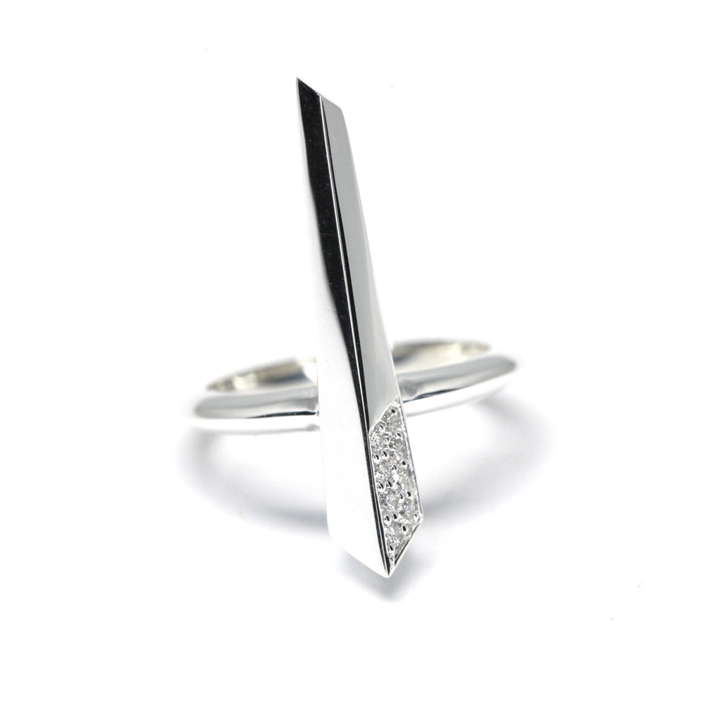 Peak ring with diamonds in sterling silver on a white background photographed in close-up. Ready-to-wear fashion jewelry available online or at our concept store in Montreal's Little Italy, along with the work of other talented jewelry designers.