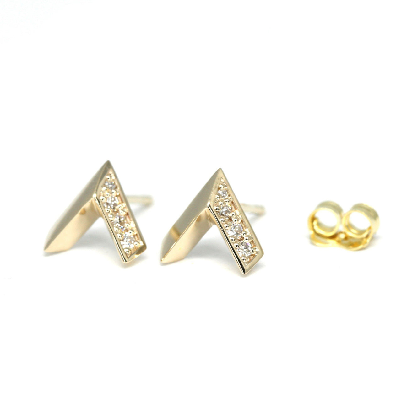 Yellow gold V-shape earrings with diamonds, designed by Bena Jewelry. The earrings feature a sleek, modern design and are part of the high-end jewelry collection. Custom-made jewelry available at Ruby Mardi in Montreal. The earrings are shown with matching yellow gold friction backs.