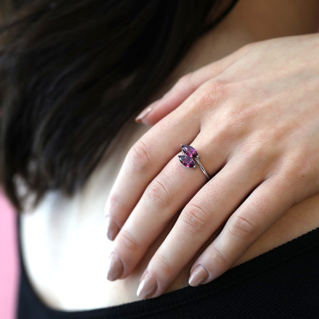 girl wearing a toi et moi rhodolite garnet white gold ring made in montreal by ruby mardi jeweler in little italy
