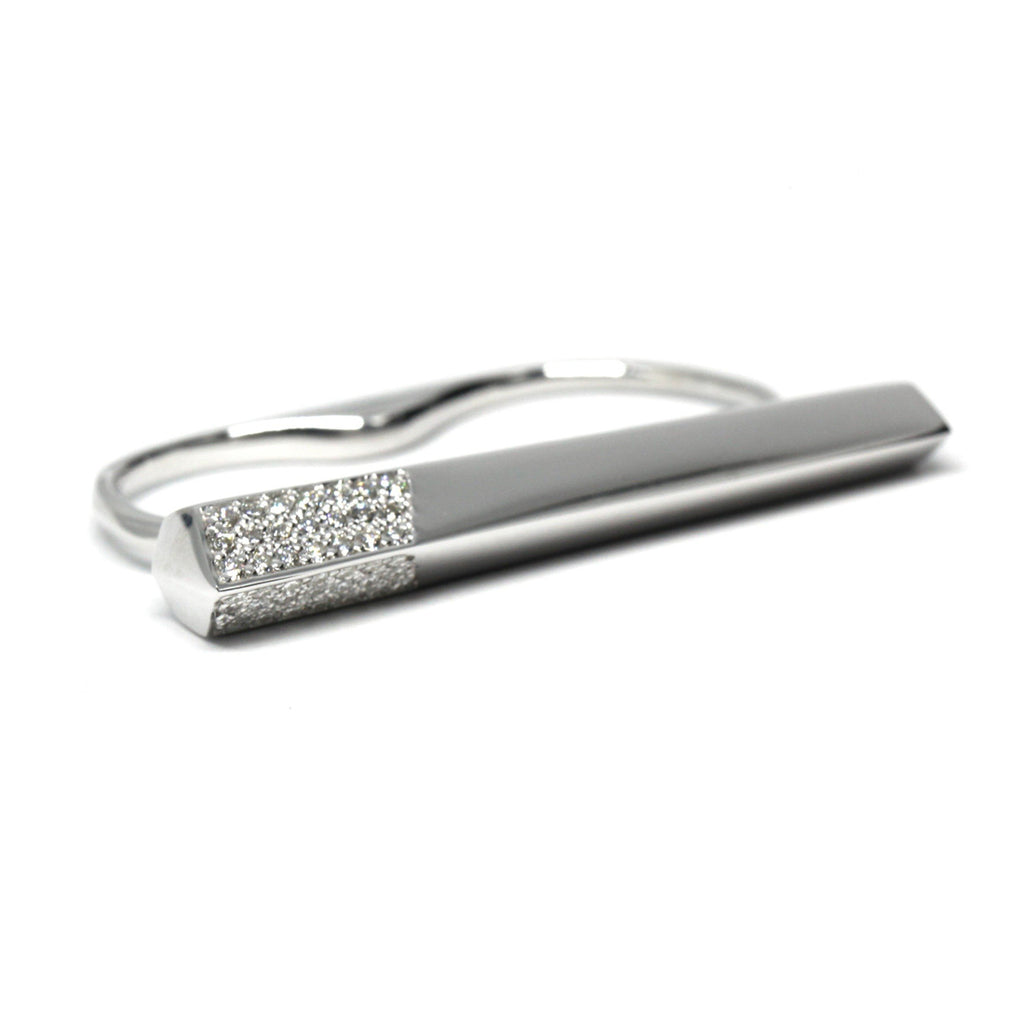 Modern double-finger ring in sterling silver with pavé diamond detailing, designed by Bena Jewelry. A statement piece available at Ruby Mardi in Montreal.
