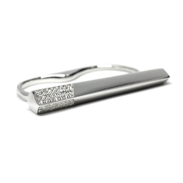 Modern double-finger ring in sterling silver with pavé diamond detailing, designed by Bena Jewelry. A statement piece available at Ruby Mardi in Montreal.