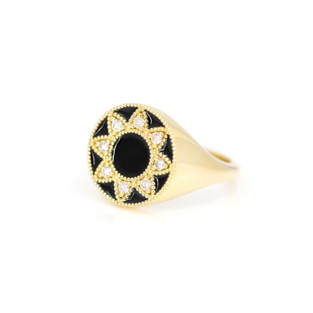 Side view of a yellow gold signet ring with black enamel and natural diamonds handcrafted in Toronto by indie jewelry designer Emily Gill and available exclusively at the best jewelry store in Montreal AND Canada, Ruby Mardi.