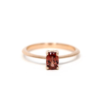 Elegant rose gold solitaire engagement ring with a burgundy malaya garnet. Ethical and sustainable handmade fine jewelry available at Ruby Mardi in Montreal’s Little Italy. We show the work of many talented Canadian jewelers.