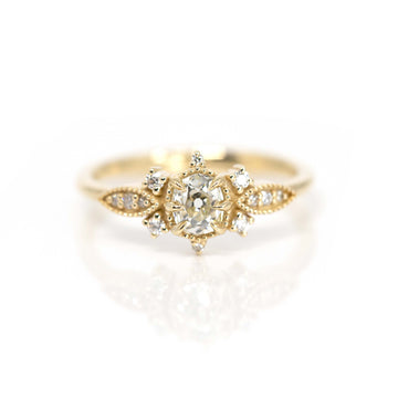 Beautiful engagement ring in 10k yellow gold with 13 natural diamonds. Work of art handmade by Nadia Werchola in Toronto, and exclusively available at Ruby Mardi in Montreal.
