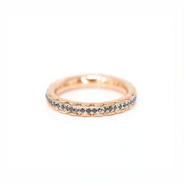 Eternity wedding ring made by the jewelry designer Janine de Dorigny made in pink gold and white gold with black diamonds. This delicate and very original ring is perfect as a wedding band or as a stacking ring. Available at Ruby Mardi Jewelry, a fine Canadian designer jewelry gallery.