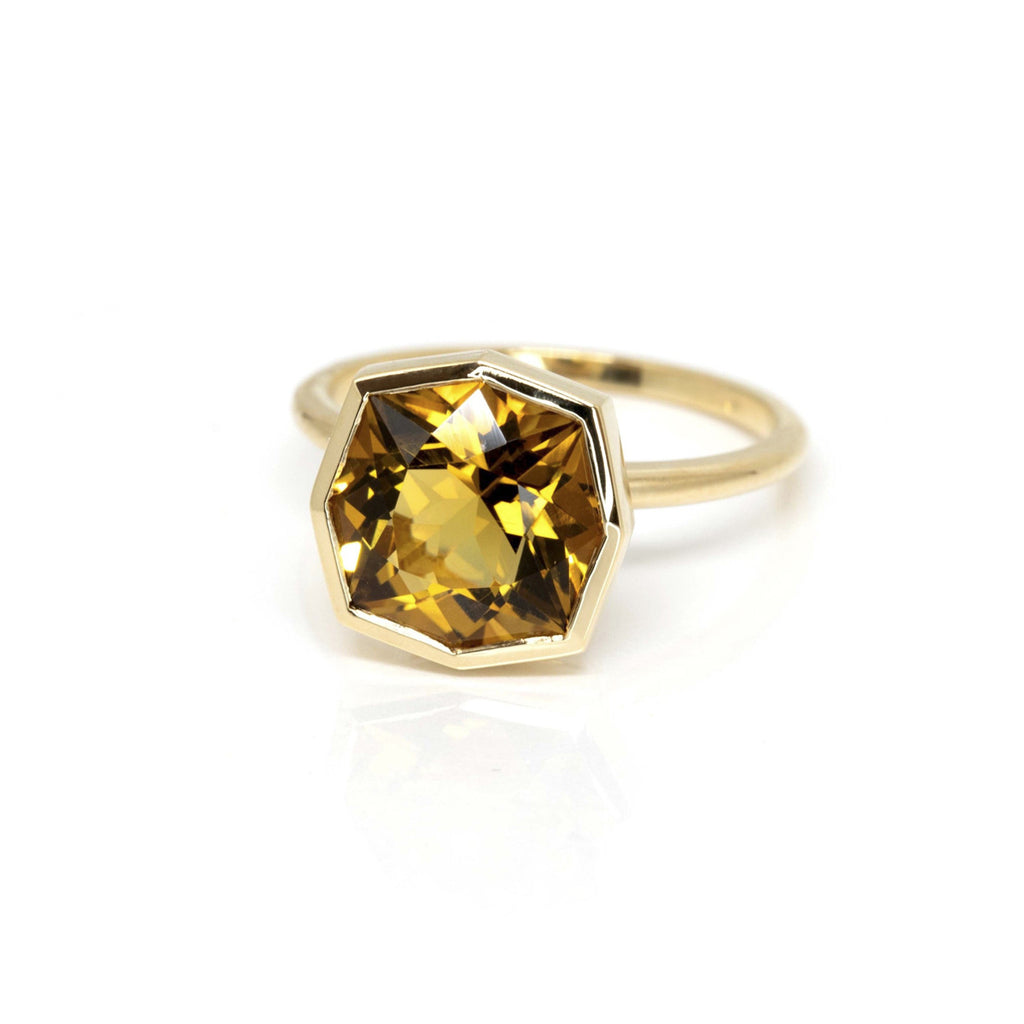  Product photography of a beautiful ring in 14k yellow gold featuring a huge fancy shape citrine, by designer Bena Jewelry. Find the most exquisite designer jewelry at Ruby Mardi, a fine jewelry store in Montreal that presents the work of the most talented Canadian jewelry designers. Custom jewelry services also offered.