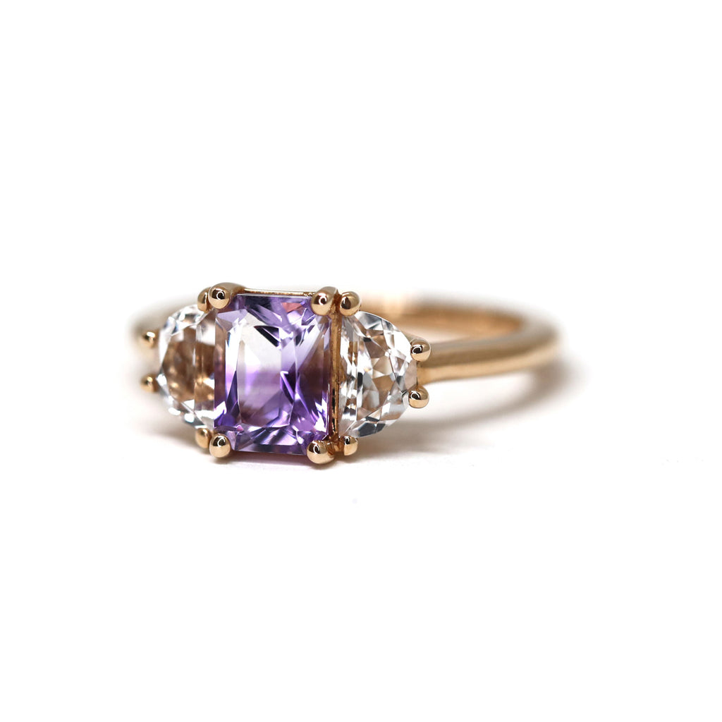 Close up on rose gold engagement ring handmade in Montreal by designer Cecilia Lico and available at high end jewelry store Ruby Mardi, located in Little Italy. Stunning bicolor amethyst and transparent topazes. 