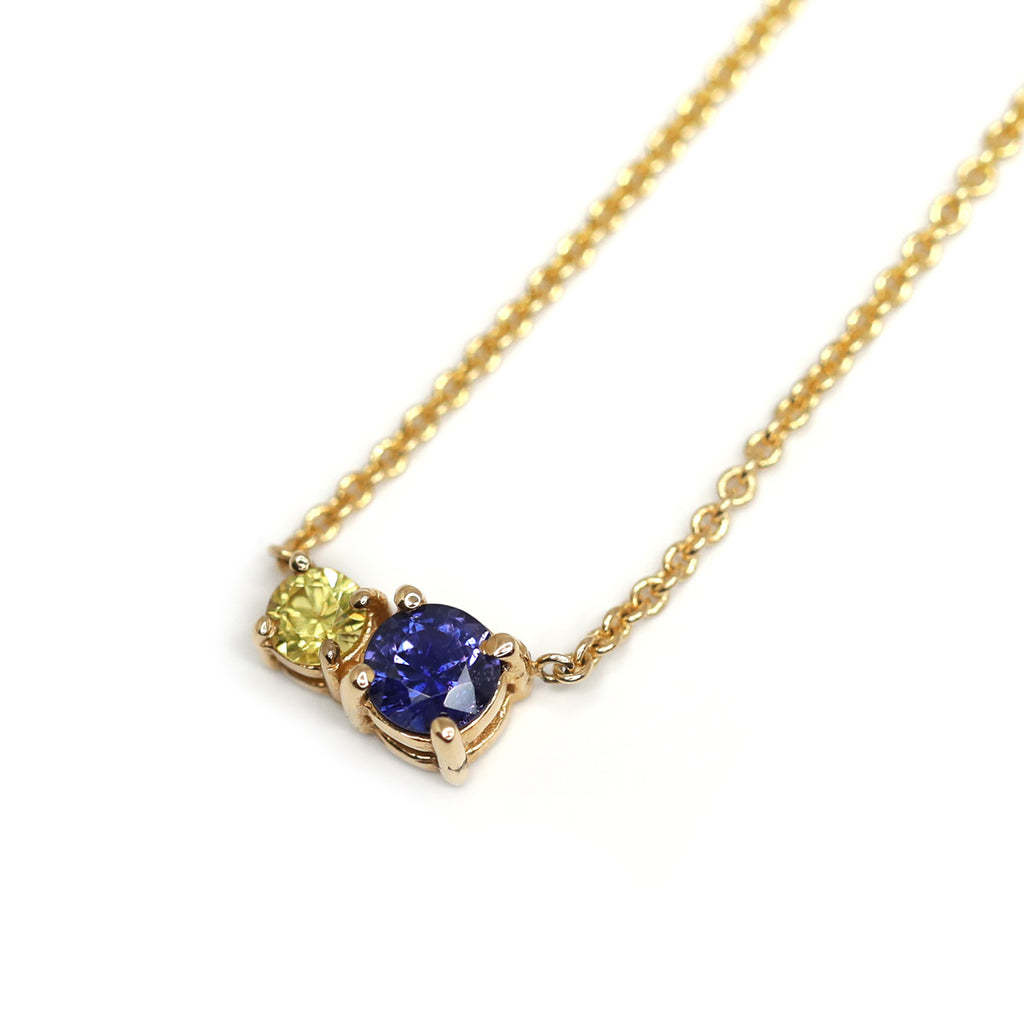 A colorful gemstone necklace in 14k gold featuring blue sapphire and yellow sapphire, handmade by Lico Jewelry in Montreal. Find it at Ruby Mardi, a high end hidden gem in Little Italy that presents the work of the most talented Canadian jewelry designer and offers custom jewelry design services.