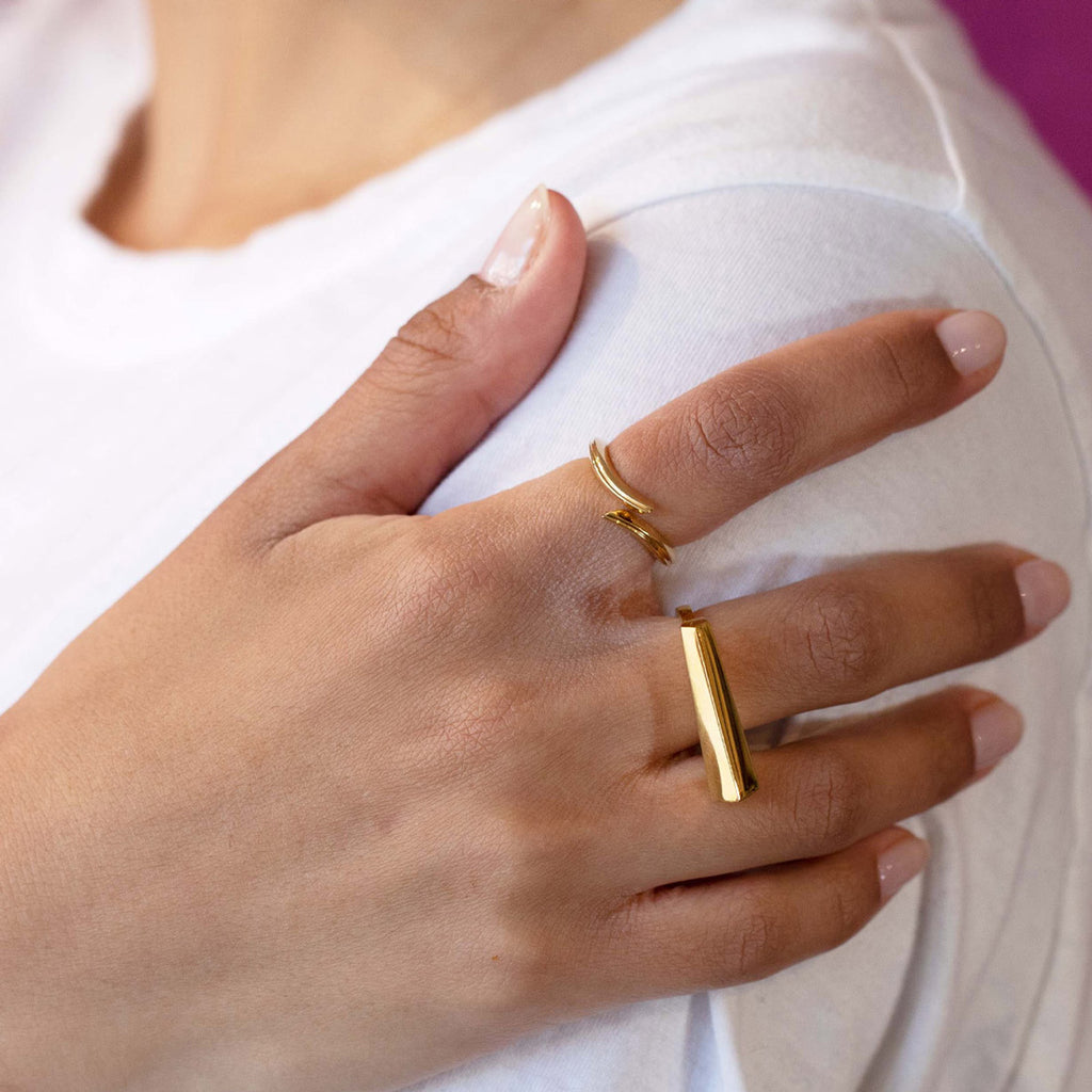 A lady wears two gold vermeil rings handmade by jewelry designer Bena Jewelry and available at Ruby Mardi. Find it online or at our jewerly store in Montreal's Little Italy.