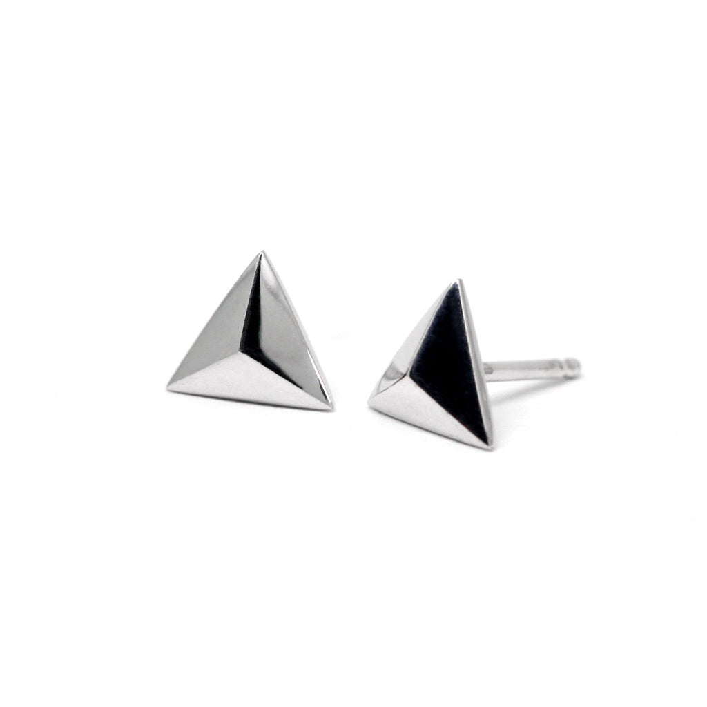 side view of silver studs montreal earrings pyramidal shape designer jewelry store boutique ruby mardi on a white background