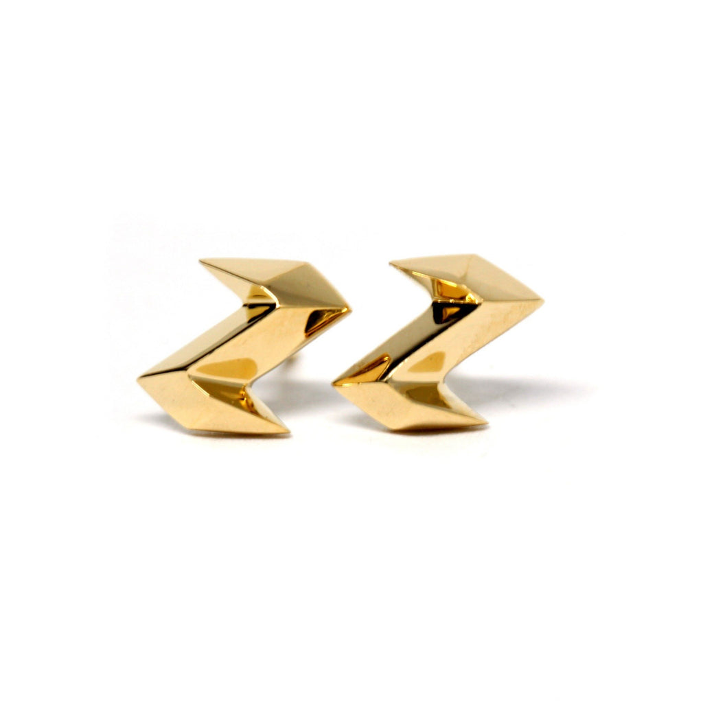 front view of edgy gold earrings unisex stud at the best jewelry store in montreal ruby mardi yellow gold vermeil studs made by the jewellery designer bena in canada on a white background