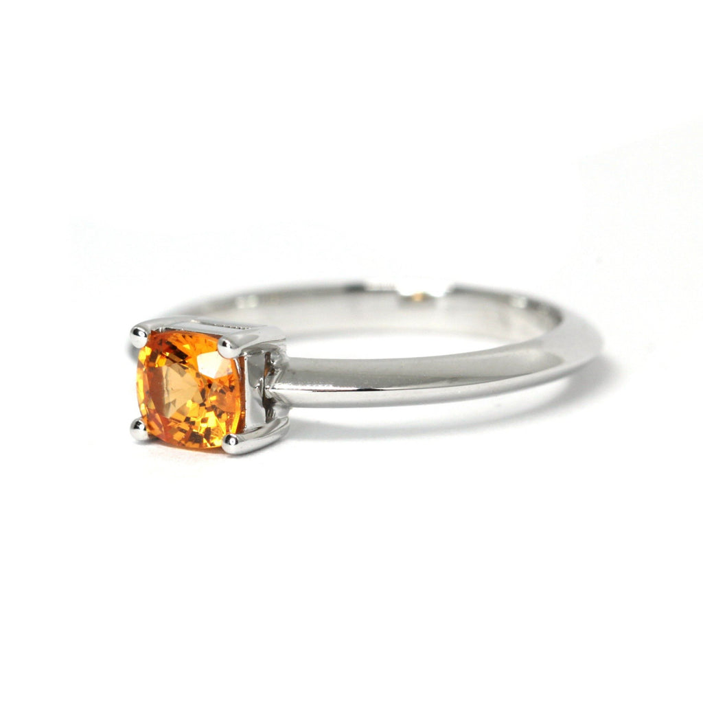 colored orange garnet gemstone engagement ring custom made in montreal by artisan jewellery designer ruby mardi on a white background