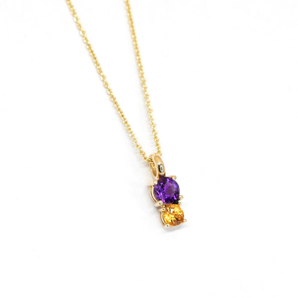side view of lico jewelry amethyst citrine toi et moi pendant made in yellow gold in montreal at the best jeweler ruby mardi on white background