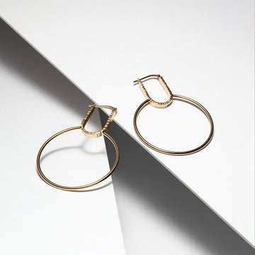 veronique roy vermeil gold large hoop earrings made in montreal by artisan jewelry designer for the best jeweler in montreal boutiqu ruby mardi on white background with grey shadow