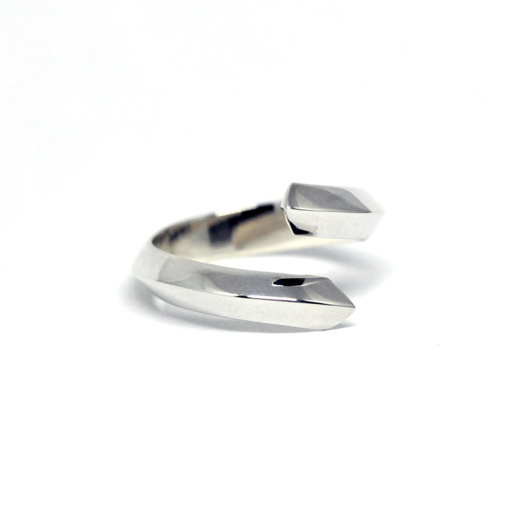 Loop ring in sterling silver on a white background photographed in close-up. Ready-to-wear fashion jewelry available online or at our concept store in Montreal's Little Italy, along with the work of other talented jewelry designers.