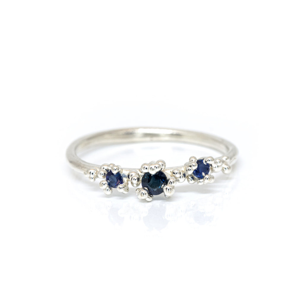 designer silver ring blue sapphire bridal jewels montreal made bespoke jewellery designers boutique ruby mardi on a white background