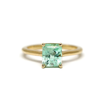 Big Mint Emerald Solitaire Gold ring on a white background by Lico Jewelry. Perfect engagement ring. 