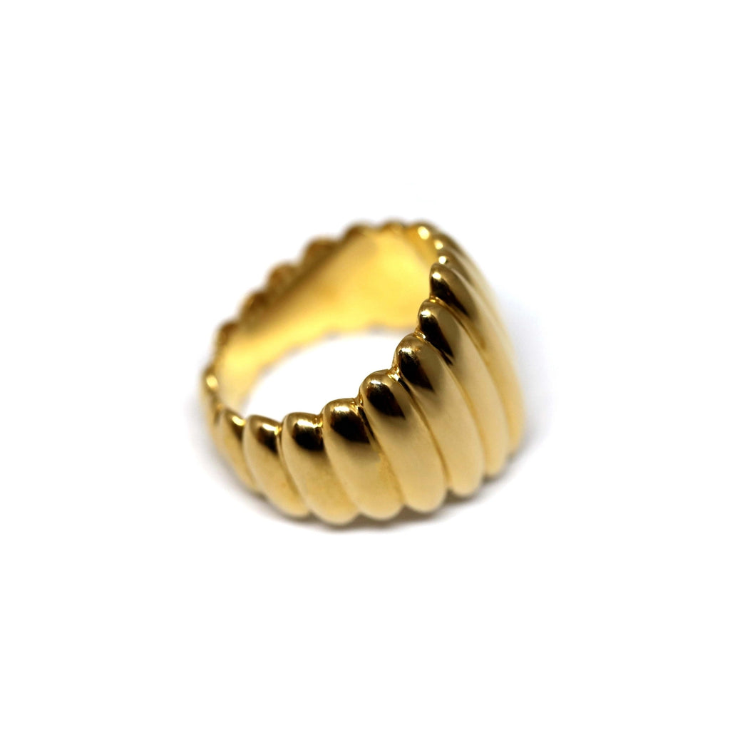 Gender neutral and modern ring designed by Bena Jewelry fashion brand in Montreal. Named Pigalle, the statement ring is seen here in its gold vermeil version and side view.