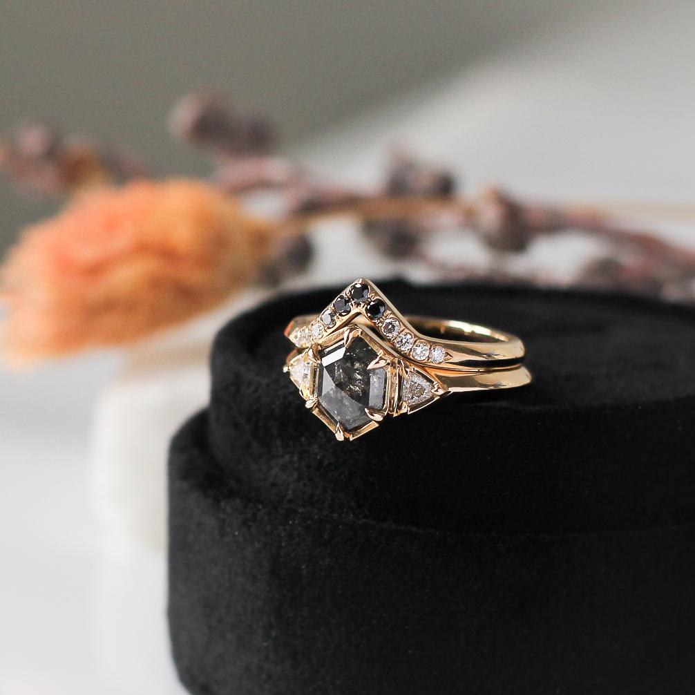 Ombré diamond band stacked with an engagement ring featuring a fancy shape black diamond, handmade by Yuliya Chorna in Toronto.  Available at Ruby Mardi, a fine jewelry store in Montreal. 