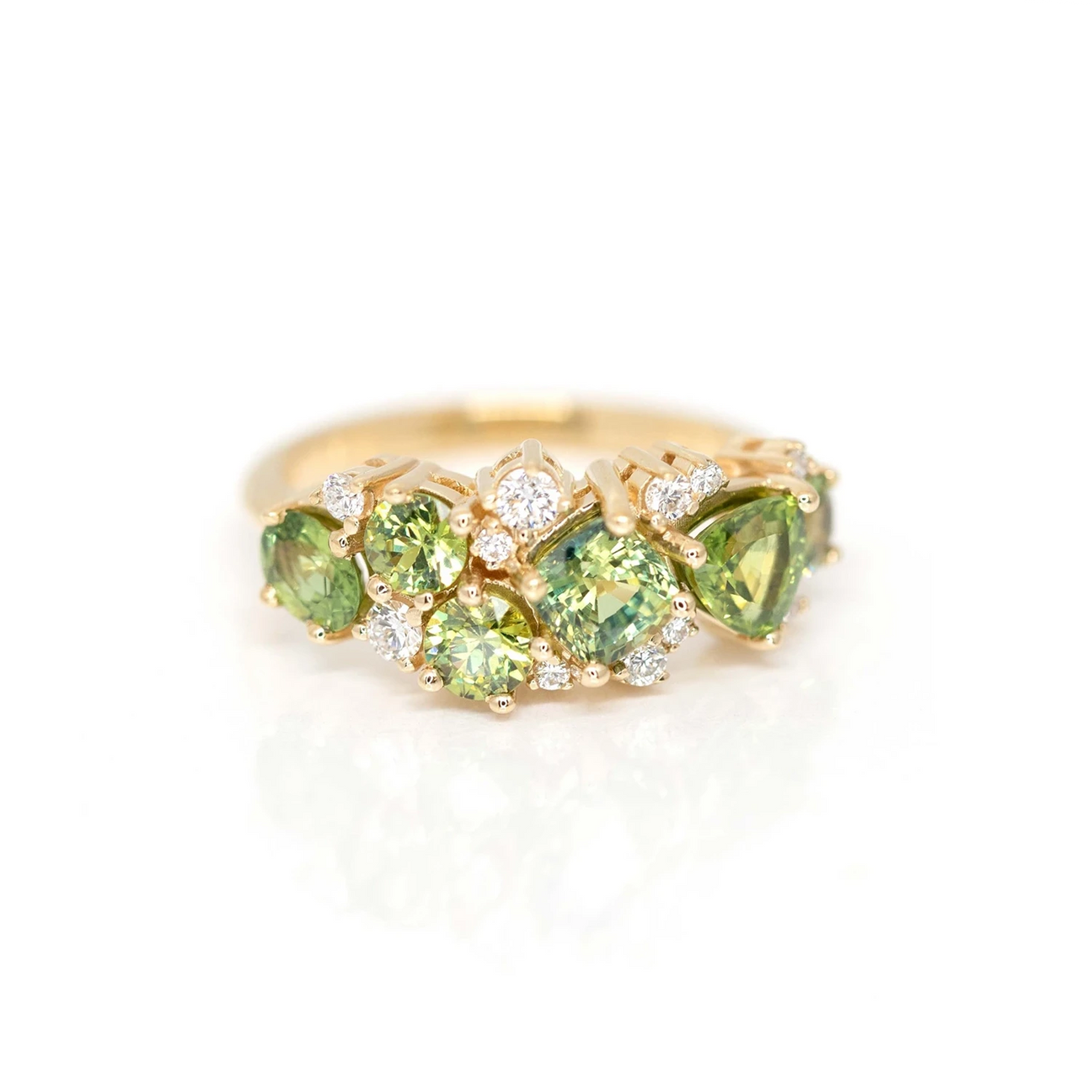 Luxury green gemstone ring in yellow gold featuring green sapphires, green garnets, and natural diamonds. Designed and crafted in Canada by upscale independent jeweler Ruby Mardi. Visit our Montreal Little Italy store or shop online.