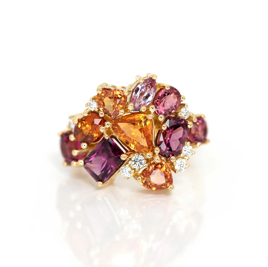 statement ring made with many orange and red gemstone sapphire garnet and diamonds custom made in montreal by bena jewelry designer for the jeweller ruby mardi