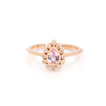 Beautiful rose gold ring with pink sapphire by jewelry designer Emily Gill. With a delicate and vintage style, this engagement ring is available exclusively at Montreal's finest jewelry store Ruby Mardi.
