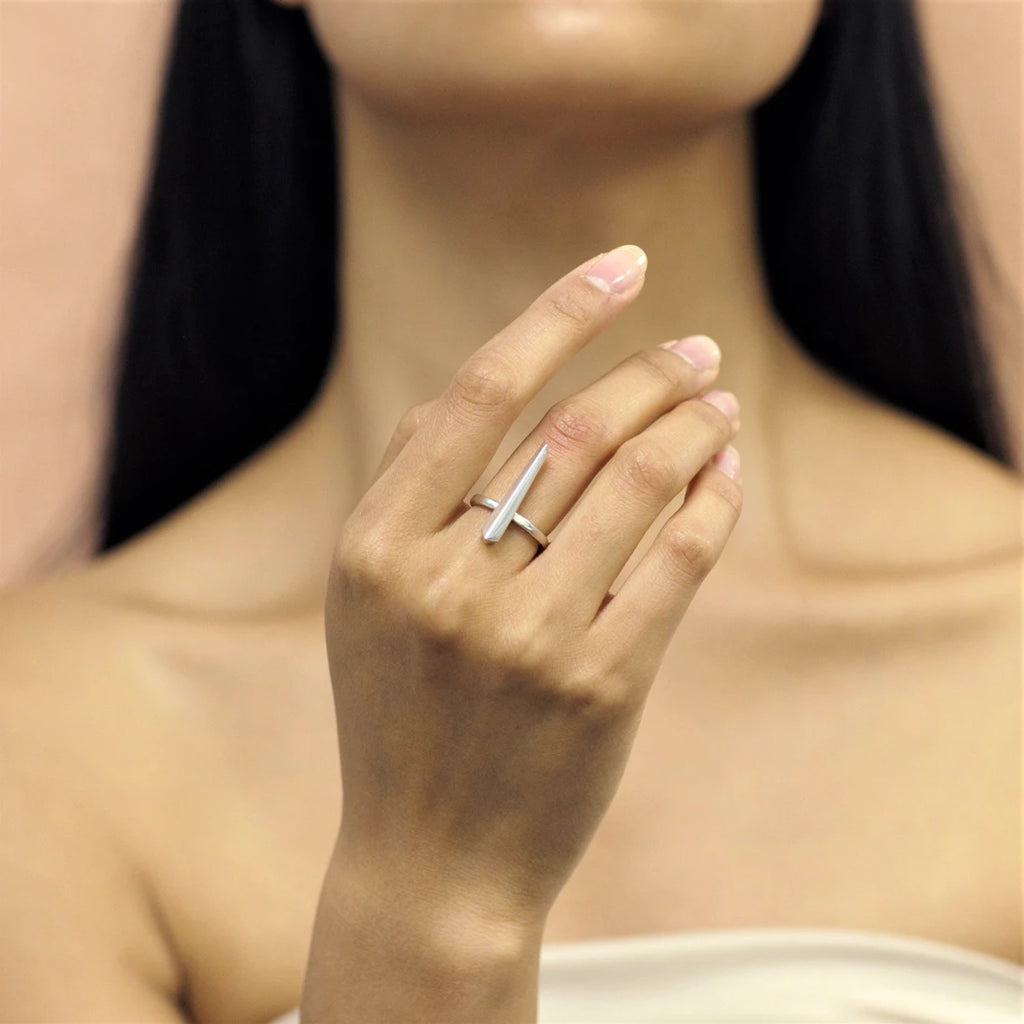 Fashion shot of PEAK RING by Bena Jewelry : a sterling silver statement gender neutral ring. Modern fine jewelry available at Ruby Mardi, the only fine jewelry gallery in Montreal. Custom jewelry services also offered.