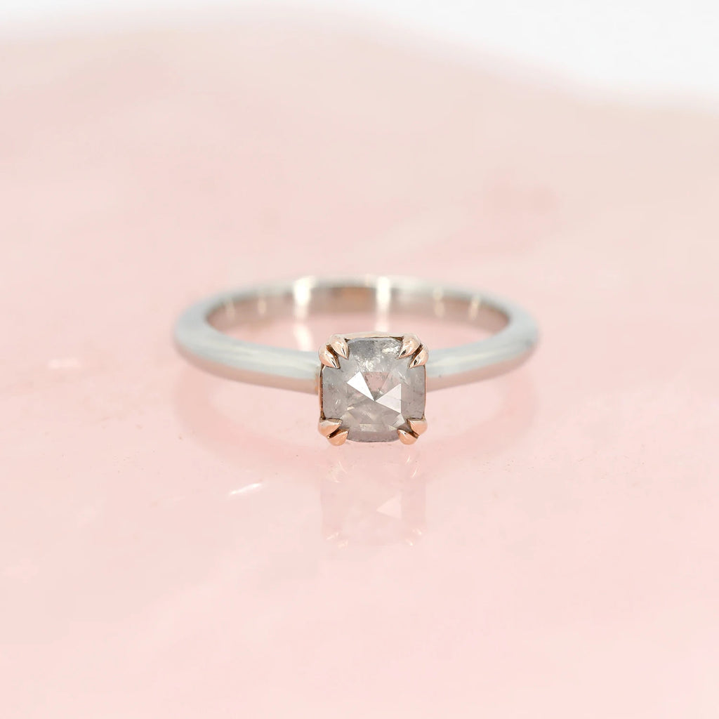 front view of custom made designer engagement ring montreal by Arsaeus design best jewelery designer in canada at boutique ruby mardi bridal jeweler on pink background