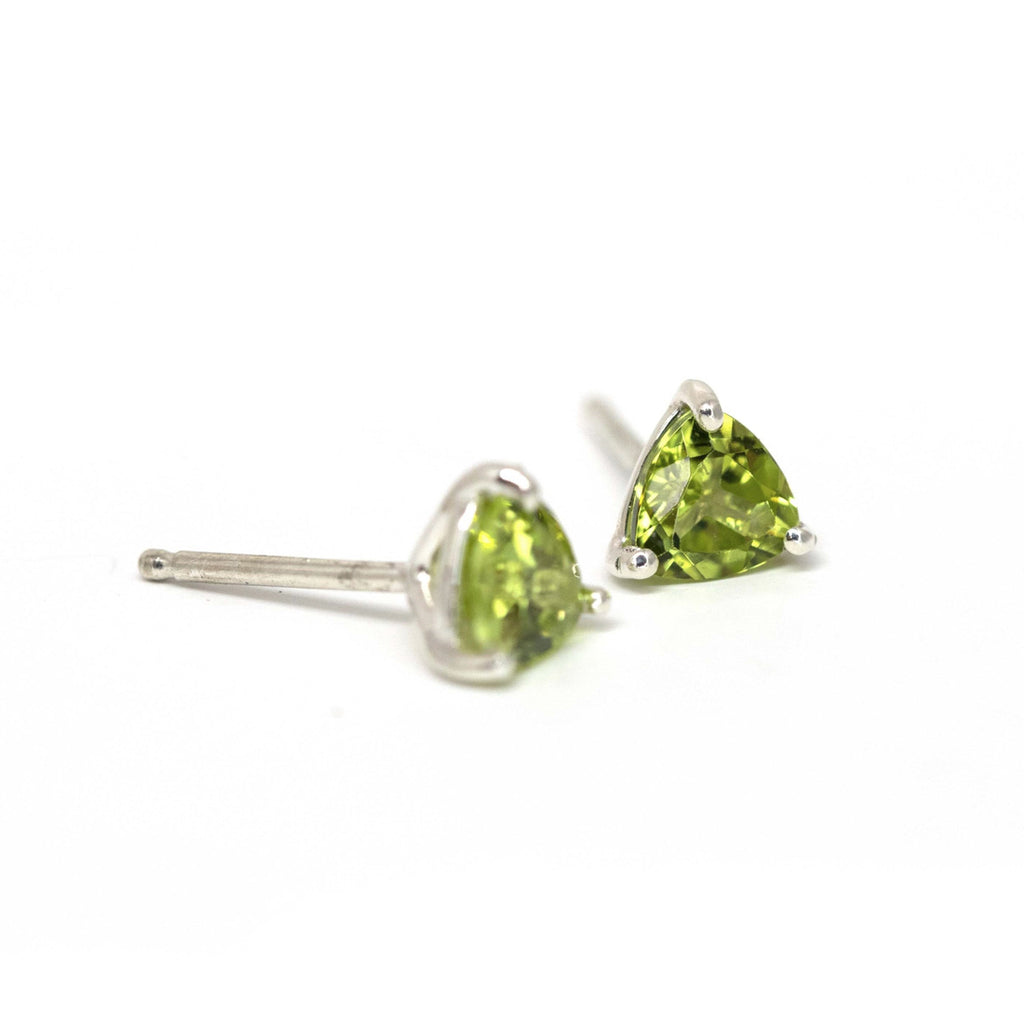 Peridot Earrings on a white background. Peridot gemstone stud silver earrings created by Ruby Mardi, a fine jewelry store in Montreal's Little Italy, close by Outremont, Rosemont, Villeray and Mile End districts. We specialize in engagement rings, gold jewelry, heirloom jewelry, bespoke, custom jewelry creation in Montreal. We can source ethical gemstones, natural diamonds, lab grown diamonds, Canadian Diamonds. We sell the work of the most talented Canadian jewelry designers.