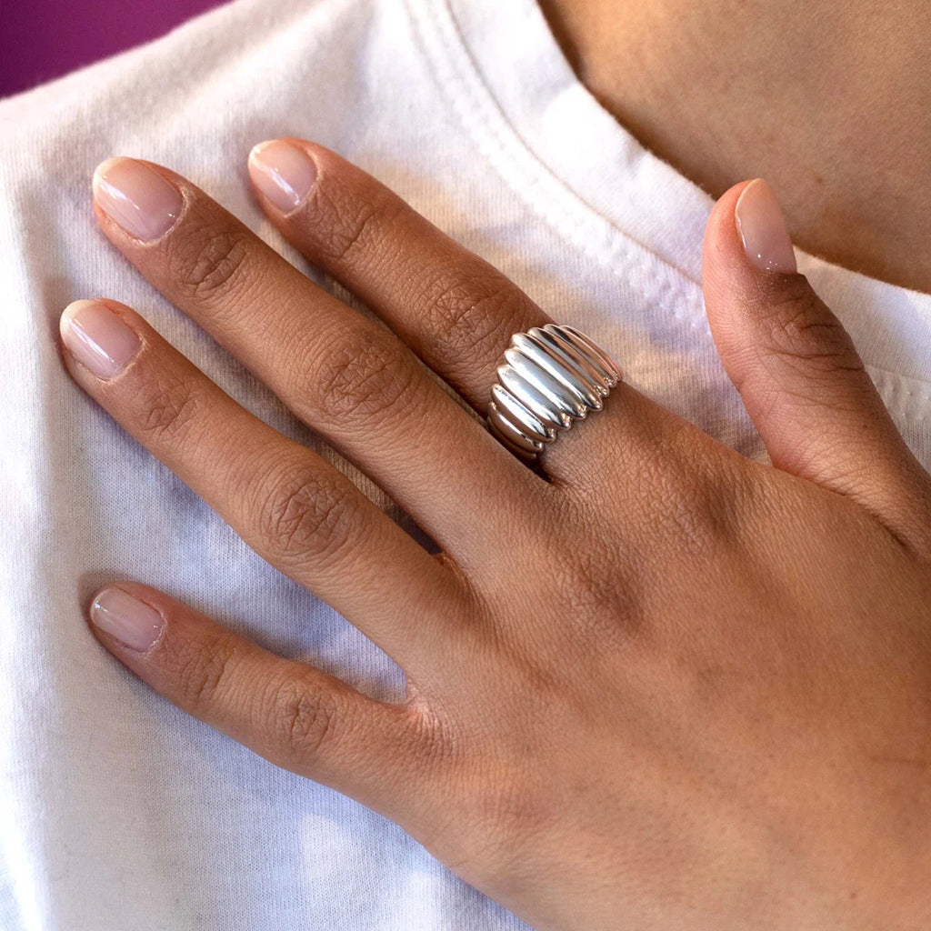 A sterling silver fashion statement ring seen worn. Gender neutral big jewelry by Canadian designer Bena Jewelry. Available in Montreal at fine store Ruby Mardi.