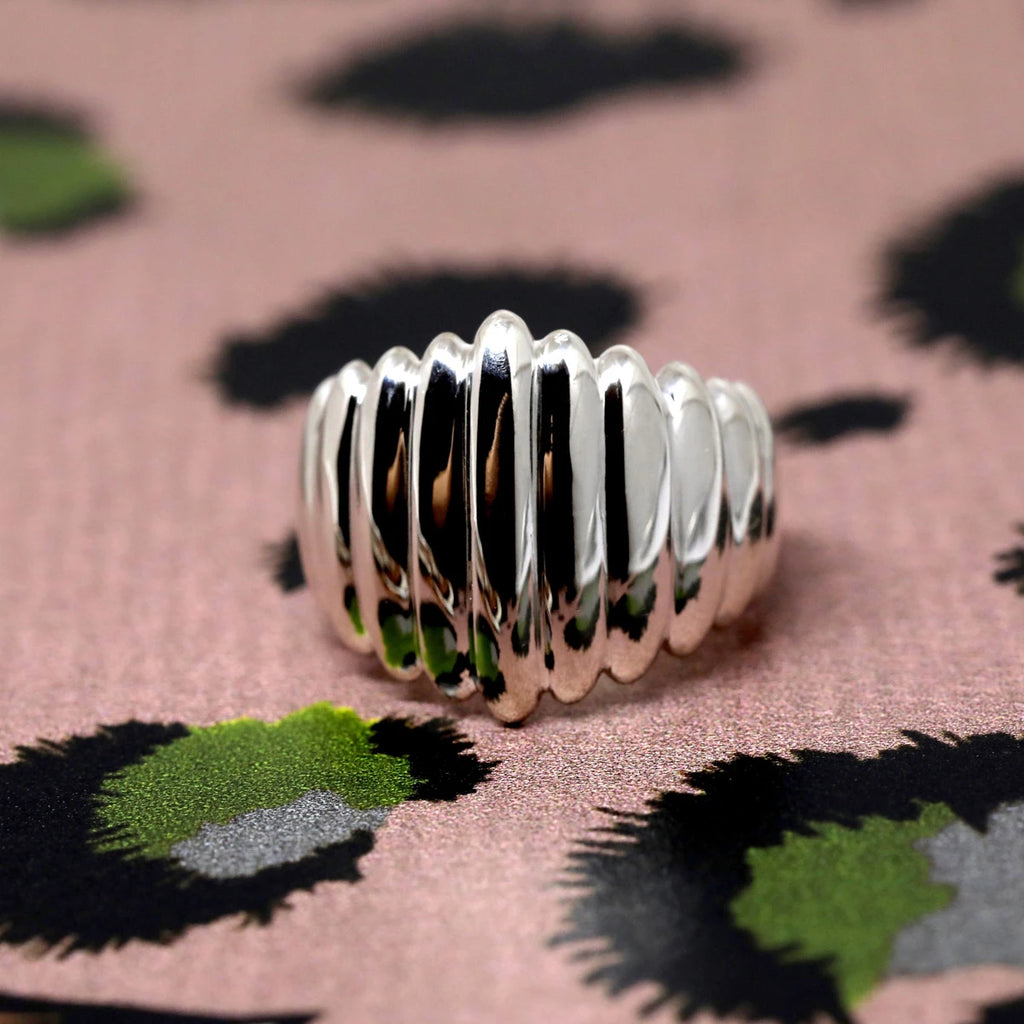 Gender neutral and modern ring designed by Bena Jewelry fashion brand in Montreal. Named Pigalle, the statement ring is seen here in its sterling silver version, but is also available in solid gold.